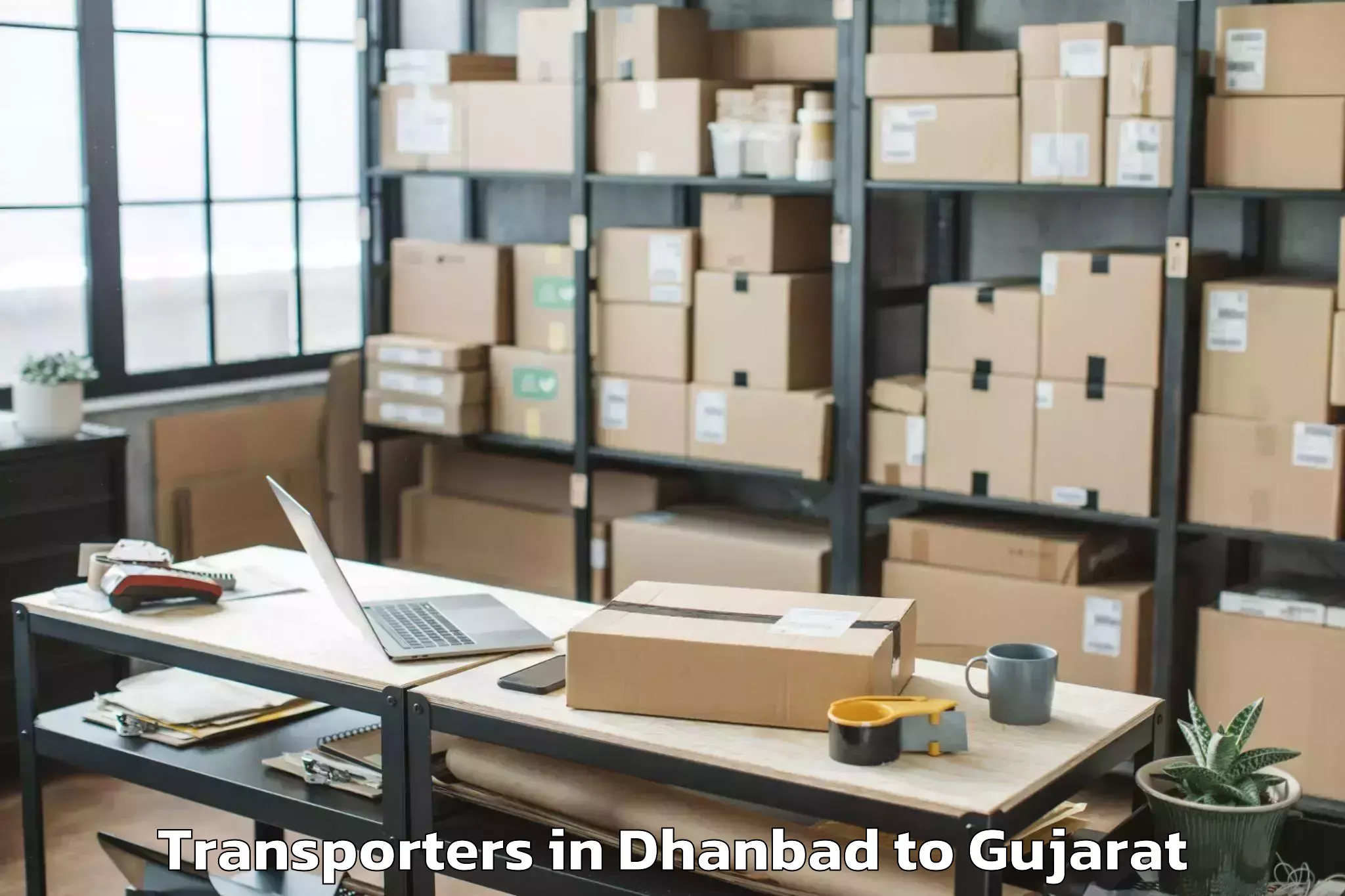 Top Dhanbad to Dhuvaran Transporters Available